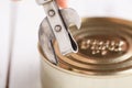 Open tinacan with knife, close up Royalty Free Stock Photo