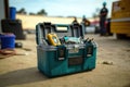 Open toolbox on construction site. Close up, focus on foreground