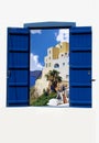 Open traditional Greek blue window on Santorini island