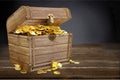 Open treasure chest filled with gold coins Royalty Free Stock Photo