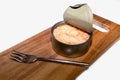 Open tuna can on cutting board with fork Royalty Free Stock Photo