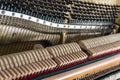 Open upright piano mechanism with strings and hammers. Royalty Free Stock Photo