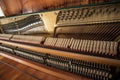 Open upright piano mechanism with strings and hammers. Royalty Free Stock Photo