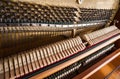 Open upright piano mechanism with strings and hammers. Royalty Free Stock Photo