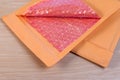 Open used yellow blank envelope with transparent bubble wrap or packaging shockproof.
