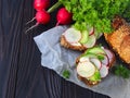 Open a vegetarian sandwich with soft cream cheese, cucumber, fresh radish and herbs. Summer Food