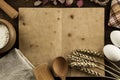 Open vintage book on the aged wooden background. Kitchen utensils, ears of wheat, flour in a pot. homemade, menu, recipe, mock Royalty Free Stock Photo