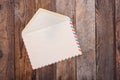 Open vintage envelope on old wooden table Royalty Free Stock Photo