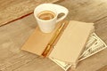 Open Vintage Notepad, Gold Pen, Hundred doolar and Cup of Espre