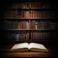 Open old book on a bookshelf background. Selective focus. Royalty Free Stock Photo