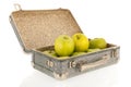 Open vintage suitcase with fruit
