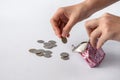 an open wallet with scattered coins in its hands on a white background Royalty Free Stock Photo