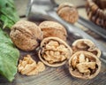 Open walnut close up, nutcracker and basket on background