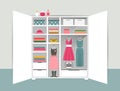 Open wardrobe. White closet with tidy clothes, shirts, sweaters, boxes and shoes. Home interior. Royalty Free Stock Photo
