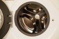 Close up of open washing machine in bathroom. Royalty Free Stock Photo