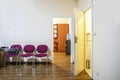 white doors in a light interior in the office with red chairs Royalty Free Stock Photo