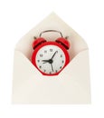 Open white envelope with alarm clock