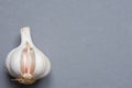 Open White Garlic Bulb with Cloves Peel on Grey Stone Background Tabletop. Flat Lay Top View. Oriental French Cuisine Concept