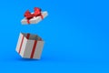 Open white gift box with red bow on blue background. Isolated 3D illustration Royalty Free Stock Photo