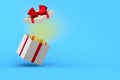 Open white gift box with red bow on blue background. Isolated 3D illustration Royalty Free Stock Photo