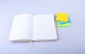 Open White notepad with colorful sticky reminder notes