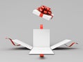 Open white present box or opened gift box with red ribbons and bow on white grey background with shadow minimal creative Royalty Free Stock Photo