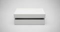 An open white rectangular gift box with its lid slightly ajar sits on a seamless light gray background, studio Royalty Free Stock Photo