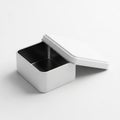 Open White Square Metal Tin Container with Lid Slightly Ajar on White Background image Royalty Free Stock Photo