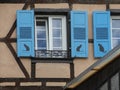 Open window with blue shutters and cat shadows Royalty Free Stock Photo