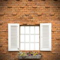 Open Window With Flower Basket On Brick Wall