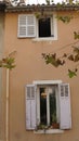 open window with flowers in an old french house Royalty Free Stock Photo