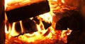 Open window in the furnace close-up. The flame has enveloped all the firewood and burns them at a high temperature Royalty Free Stock Photo