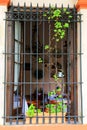 Open window with security bars in Colonia del Sacramento, Uruguay Royalty Free Stock Photo