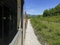 An open window view from a train on the line Podgorica - Bar near Scadar lake Royalty Free Stock Photo