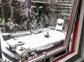 Open window on a winter day. Winter and snow outside the window in the garden.