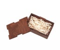 Open wooden box with filling material inside. Empty natural wooden box with decorative straw for happy gifts