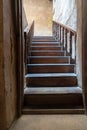 Open wooden door revealing wooden old staircase going up, Cairo, Egypt