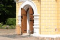 Open wooden doors of the old temple. Arch entrance, oak wood doors Royalty Free Stock Photo