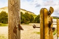 Open wooden fence entrance to a farm