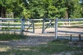 Open wooden gate, rural fence, horse parade ground Royalty Free Stock Photo