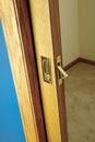 Open wooden pocket door slid back into the wall
