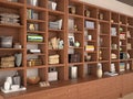 Open wooden shelves with different filling. Royalty Free Stock Photo