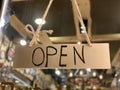 Open wooden sign at the shop window of a traditional Chtistmas gift shop in Eastern European Baltic Riga Latvia Royalty Free Stock Photo