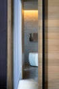 Open wooden sliding bathroom door shot vertically Royalty Free Stock Photo