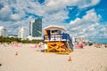 Open wooden tower with lifeguard man patrolling sea beach