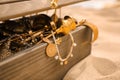 Open wooden treasure chest on sandy beach, closeup Royalty Free Stock Photo