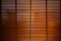 Open wooden venetian blinds. lighting range control sunlight coming from a window. decoration interior. Modern jalousie Royalty Free Stock Photo