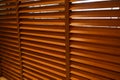 Open wooden venetian blinds. lighting range control sunlight coming from a window. decoration interior. Modern jalousie Royalty Free Stock Photo