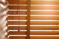 Open wooden venetian blinds. lighting range control sunlight coming from a window. decoration interior. Modern jalousie