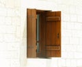 Open wooden window against a white wall Royalty Free Stock Photo